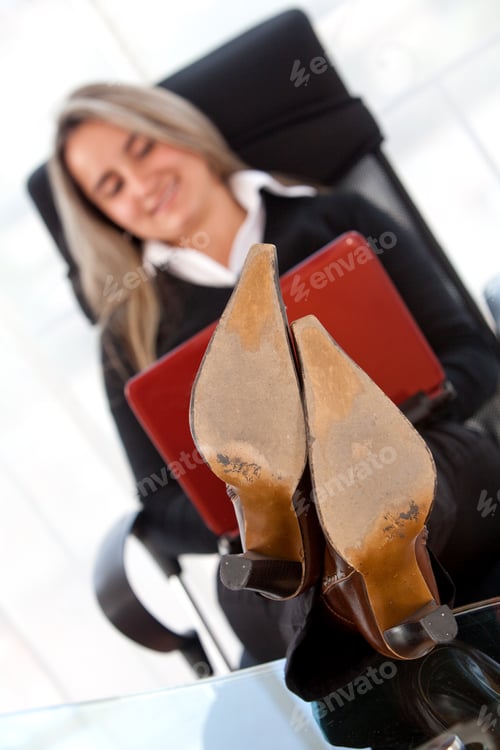 Preview: Young Business Woman Sitting Comfortably On Desk