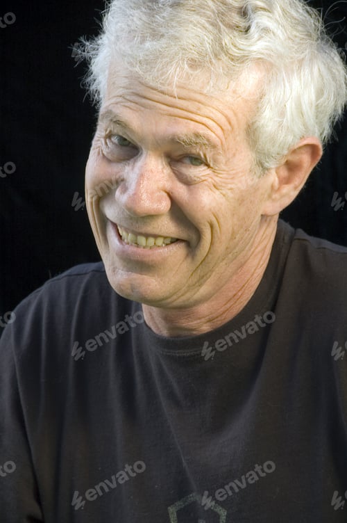 Preview: White-Haired Man With Wicked Grin, Dark Background