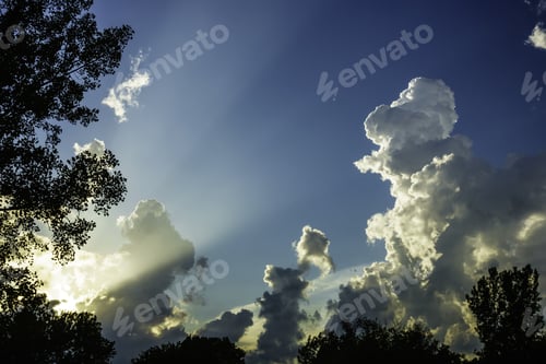 Preview: Transitional Light Show On A Summer Evening: Crepuscular Rays Light Up A Partly Cloudy Sky, With