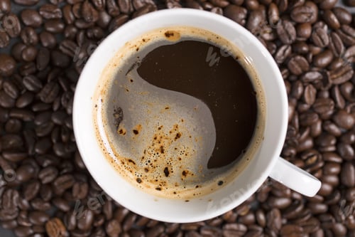 Preview: Still Life Of Fresh Roasted Coffee Beans With A White Mug On A Black Slate Surface