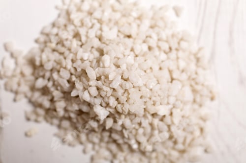 Preview: Detail Of A Pile Of White Sand On A Light Wooden Surface