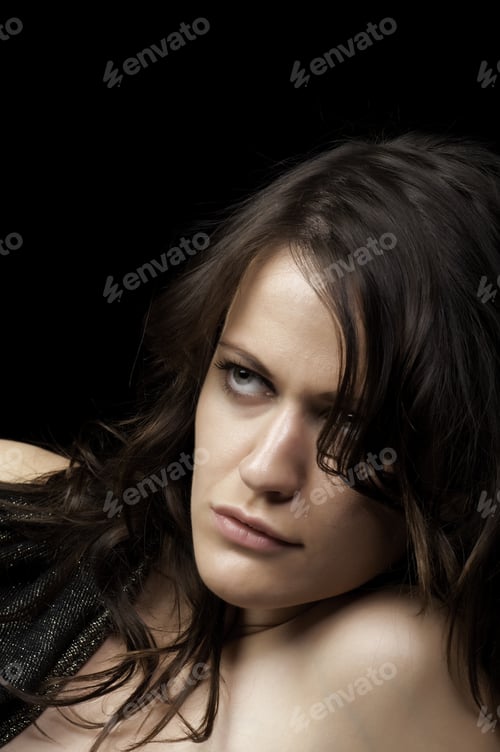 Preview: Sultry Young Woman Leaning On Her Left Elbow