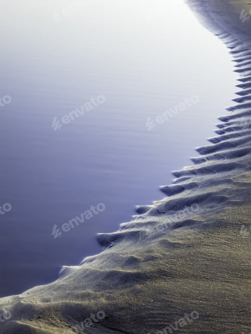 Preview: Abstract Pattern Created By Ocean Tide: Evening Tidal Pool With Serrated Edge In Sand On Kalaloch