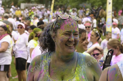 Preview: Lake Zurich, Illinois, Usa - June 20, 2015: A Woman Doused In Colored Powder Grins Before The 5K