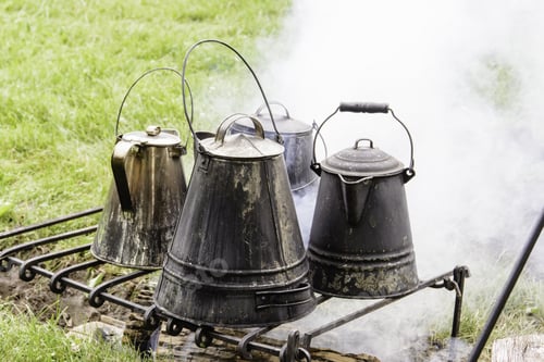 Preview: Four Vintage Coffeepots Over A Smoky Campfire