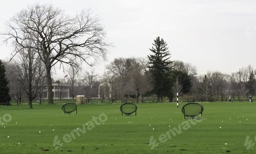 Preview: Three Round Target Nets Surrounded By Golf Balls On Driving Range In Spring, Northern Illinois