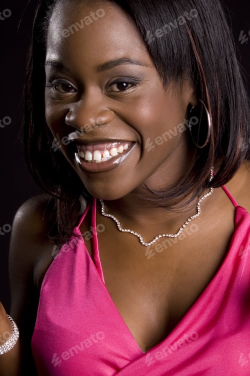 Preview: Pretty Young African-American Woman In Pink Dress, Smiling