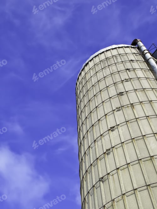 Preview: Silo Of Poured Concrete Under Blue Sky With High Wispy Clouds