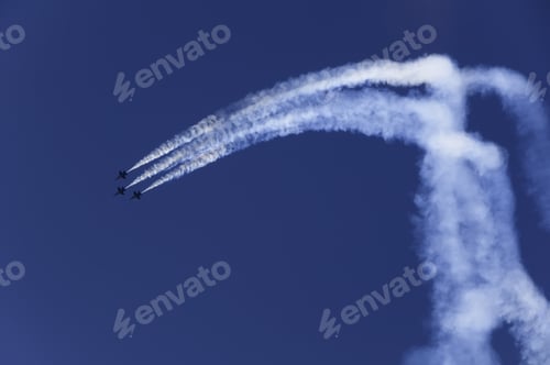 Preview: Janesville, Wi - May 31: F-18 Hornets Make A Sharp Turn During A Navy Blue Angels Demonstration At