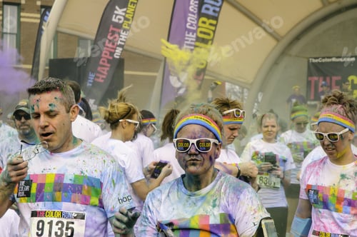 Preview: Kalamazoo, Michigan, Usa - April 12, 2014: Runners Enjoy Fresh Air After Tossing Packets Of Colored