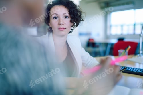Preview: Unposed Group Of Creative Business People In An Open Concept Office Brainstorming Their Next