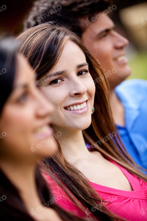 Preview: Woman Standing Out From A Group Of People And Smiling
