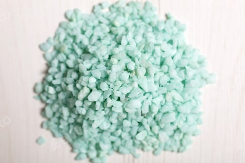 Preview: Detail Of A Pile Of Blue Sand On A Light Wooden Surface