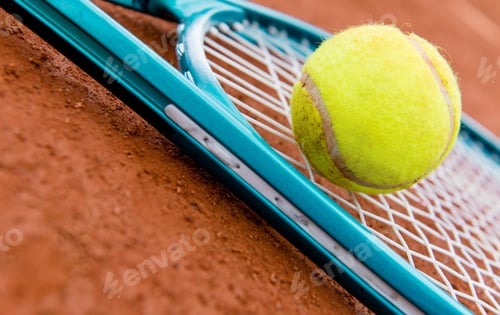 Preview: Tennis Racket With A Ball At The Clay Court