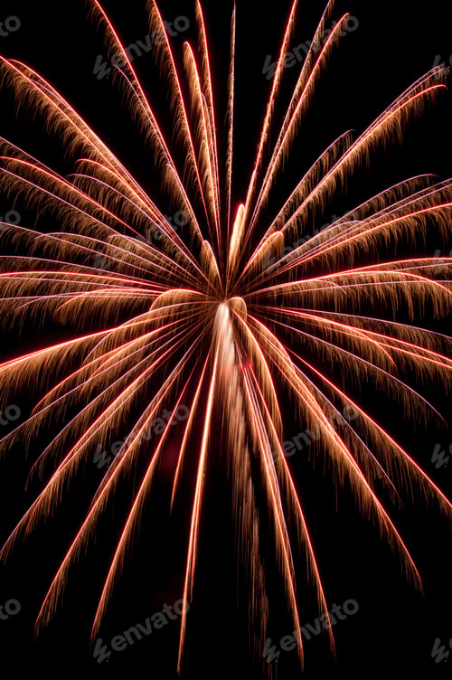 Preview: Large Burst Of Fireworks With Yellow-Orange Streaks Feathery From Motion Blur