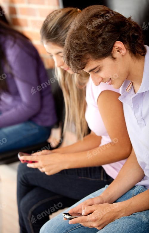 Preview: Young People Texting On Their Cell Phones - Isolated Over A White Background