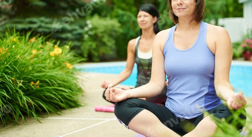 Preview: Two Mature Women Keeping Fit By Doing Yoga In The Summer