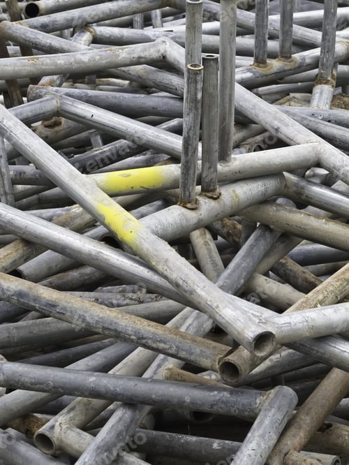 Preview: Industrial Helter-Skelter: Pile Of Metal Pipes On Construction Site