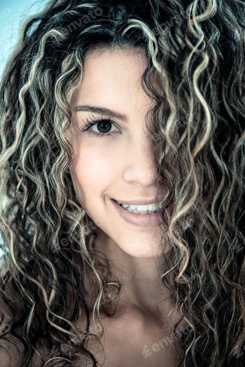 Preview: Beauty Portrait Of A Woman With Beautiful Curls In Her Hair