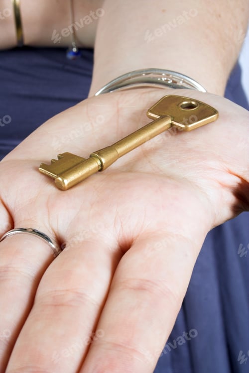 Preview: Golden Key On A Hand
