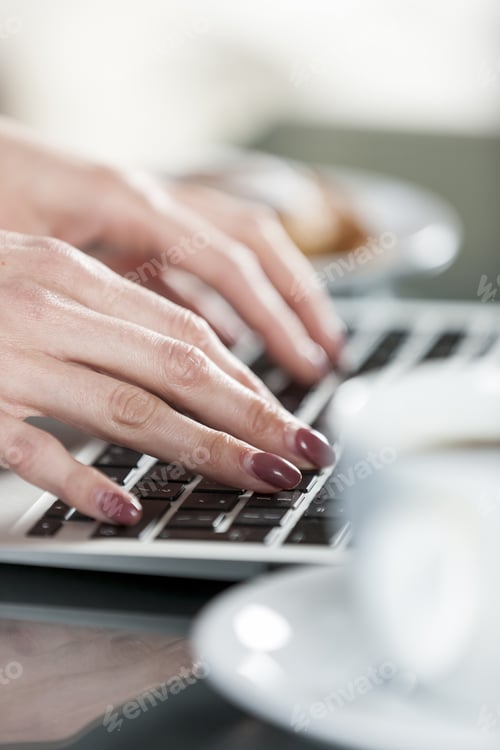 Preview: Woman'S Hands Typing On A Laptop Keyboard With Coffee And Fresh Cake