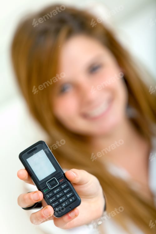 Preview: Girl Displaying A Cell Phone - Focus On Mobile