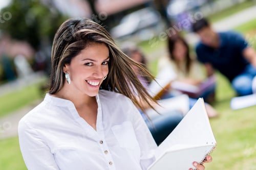 Preview: Beautiful Female Student Smiling At The University Campus