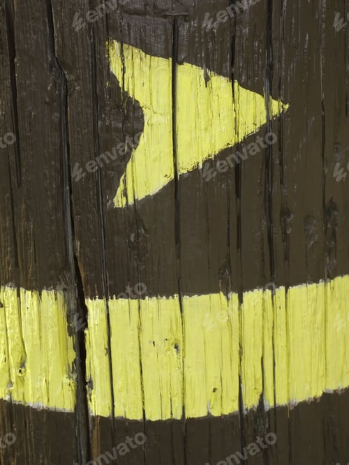 Preview: Yellow Trail Marker On Cracked Wooden Post In Forest Preserve