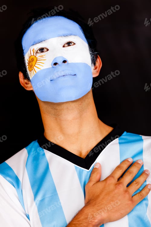Preview: Proud Argentinean Man With Hand On Heart - Isolated Over A Black Background