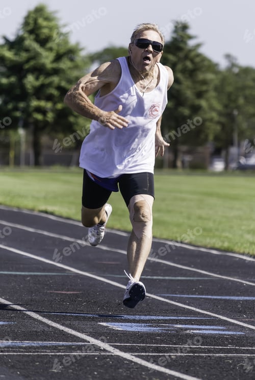 Preview: Park Ridge, Illinois, Usa - July 23, 2015: A Senior Runner Sprints Toward The Finish Of A 400-Meter