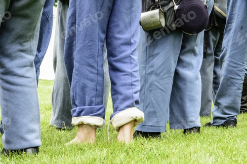Preview: Wauconda, Illinois/Usa - July 12, 2014: A Young Volunteer Stands Barefoot, Unlike His Fellow Union