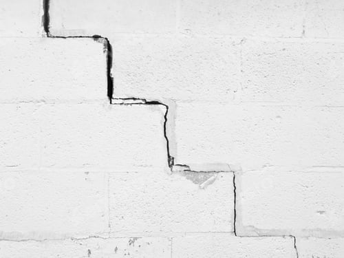 Preview: Continuous Crack, Angled Like A Stairway, Along Exterior White Wall