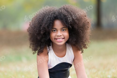 Preview: Portrait Of Happy Smiling African American Little Girl Doing Yoga Outdoor. Little Afro Girl With