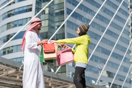 Preview: Arabic Man And Tourist Woman Shopping In City