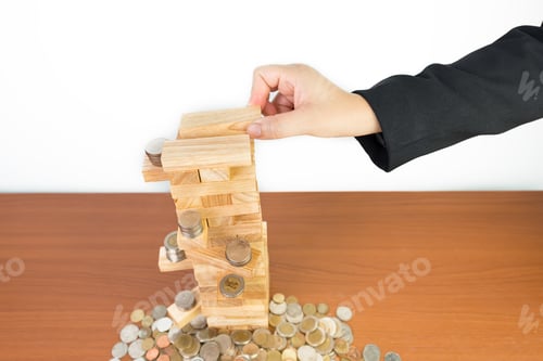 Preview: Hand Of Businesswoman Pulling Out Or Placing Wood Block Isolated On White Background,Planning, Risk