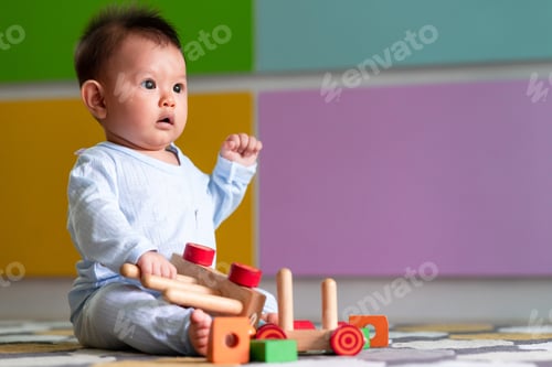 Preview: Asian Male Toddler Playing With His Toy On The Floor. Very Shocking Look.