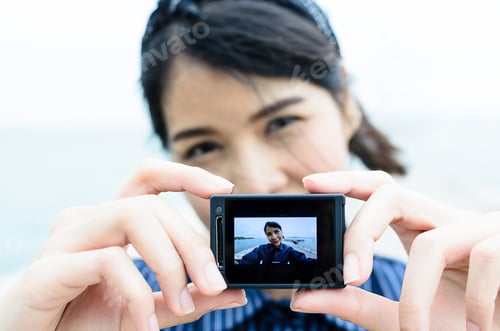 Preview: A Woman Has Camera Focusing And Selfie To Herself Above The Sea On Holiday Time. With Happy Feeling