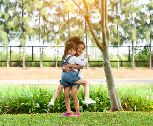 Preview: Children Hug Each Other With Love And Playing Together In The Outdoor Park