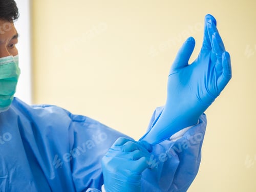 Preview: Doctor Putting Glove In Clinic At Hospital