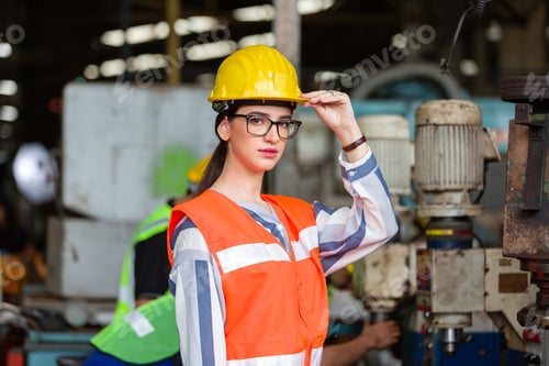 Preview: Portrait Of Female Caucasian Worker Standing In Front Of The Machine In The Factory Industry While