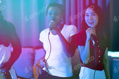 Preview: Group Of Young People Having A House Party Together. African American, Asian Man And Woman. Enjoy