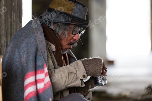 Preview: Elderly Homeless And Hungry Man Eating Food At Abandoned Building Or On Street