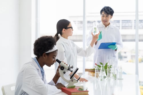 Preview: Asian Teacher And Diverse Student Doing Tests Of Plants In Classroom. Group Of Diversity Scientists