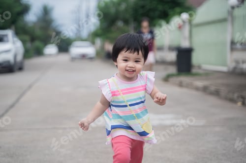 Preview: Portrait Of Cute Baby Running On The Road