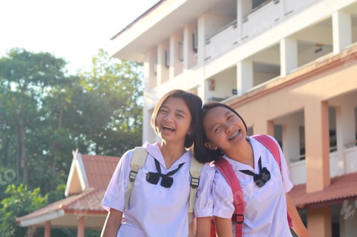 Preview: Two Happy Young Student Asia Girl At School .