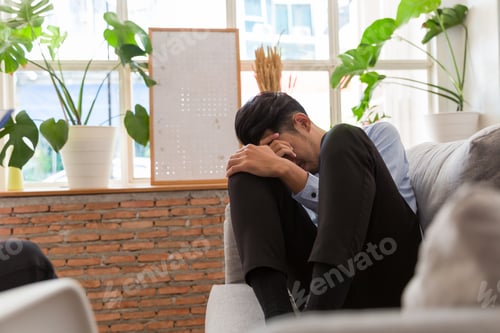 Preview: Stressed Young Asian Man And Put Hands On His Head And Talking With Professional Psychologist While