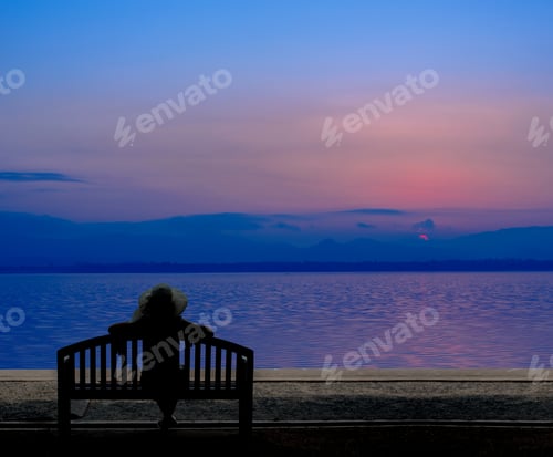 Preview: Silhouette Women Sitting Alone. Sad And Lonely.Sea And Beach On Summer.