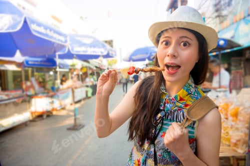 Preview: Young People Traveler Shopping On The Amphawa Floating Market Street And Buying Delicious Beef