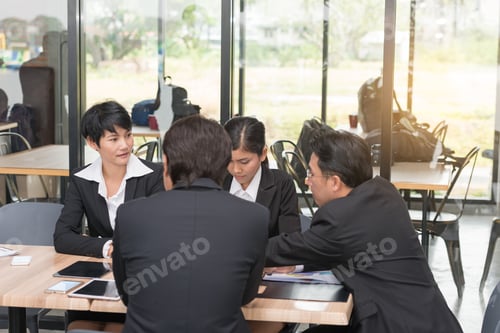 Preview: Group Of Business Team And Business A Meeting On Cafe Background