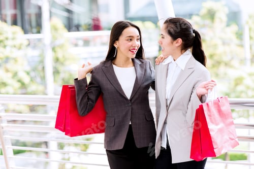 Preview: Two Beautiful Girls Shopping Together. Asian Woman And White Girl Smartly Dress Going Out Shopping